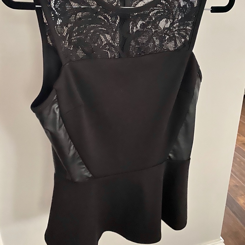 Sleeveless Black Peplum Top